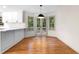 Cozy breakfast nook with hardwood floors, a modern pendant light, and access to an outdoor deck at 5236 Forest Brook Pkwy, Marietta, GA 30068