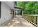 Outdoor wooden deck overlooking the yard with access to a screened-in porch at 5236 Forest Brook Pkwy, Marietta, GA 30068