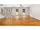 Open-concept living room with hardwood floors, a staircase, and large windows at 5236 Forest Brook Pkwy, Marietta, GA 30068