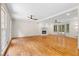 Bright and spacious living room with hardwood floors, fireplace, ceiling fans and french doors at 5236 Forest Brook Pkwy, Marietta, GA 30068