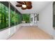 Cozy screened porch with wood flooring and views of the surrounding greenery at 5236 Forest Brook Pkwy, Marietta, GA 30068