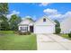 Charming single-Gathering home featuring a two-car garage, manicured lawn, and blossoming landscape at 7057 Silver Bend Ovrlk, Austell, GA 30168