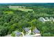 Lush green surroundings envelop this neighborhood near open fields at 141 Olde Heritage Way, Woodstock, GA 30188