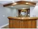 Spacious bar area with wooden accents and shelving at 141 Olde Heritage Way, Woodstock, GA 30188