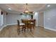 Elegant bar area with a wooden bar, and hardwood floors at 141 Olde Heritage Way, Woodstock, GA 30188