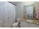 Bright bathroom with a vanity and decorative shower curtain at 141 Olde Heritage Way, Woodstock, GA 30188