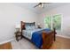 Comfortable bedroom with natural light, hardwood floors, and stylish bedding at 141 Olde Heritage Way, Woodstock, GA 30188