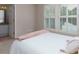 Serene bedroom with a neutral color palette and lots of natural light at 141 Olde Heritage Way, Woodstock, GA 30188