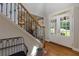 Inviting foyer featuring hardwood floors, and grand entrance with natural light at 141 Olde Heritage Way, Woodstock, GA 30188