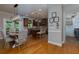 Open concept kitchen, adjoining breakfast and laundry rooms featuring wooden cabinets and hardwood floors at 141 Olde Heritage Way, Woodstock, GA 30188