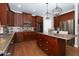 Kitchen with wooden cabinets, granite countertops, and stainless steel appliances at 141 Olde Heritage Way, Woodstock, GA 30188