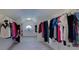 Bright walk-in closet with hanging rods, and natural light at 141 Olde Heritage Way, Woodstock, GA 30188