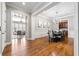 Formal dining room featuring hardwood floors, elegant chandelier, and access to a living room area at 2412 St Davids Sq # 16, Kennesaw, GA 30152