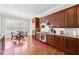 Bright kitchen with stainless appliances, wooden cabinets, granite countertops, and breakfast nook at 2412 St Davids Sq # 16, Kennesaw, GA 30152