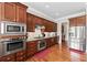 Gourmet kitchen boasts stainless steel appliances, granite countertops, and custom cabinetry at 2412 St Davids Sq # 16, Kennesaw, GA 30152