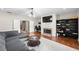 Spacious living room boasts a brick fireplace and hardwood floors at 2412 St Davids Sq # 16, Kennesaw, GA 30152