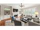 Cozy living room with fireplace, built-in shelving, comfortable seating, and natural light at 2412 St Davids Sq # 16, Kennesaw, GA 30152