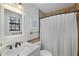 Bathroom featuring a vanity, framed mirror, and shower with tile surround and a shower curtain at 3841 Admiral Dr, Atlanta, GA 30341