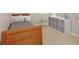 Bright bedroom with a twin bed, storage cubes, and neutral decor, creating a serene and organized space at 3841 Admiral Dr, Atlanta, GA 30341