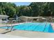 Large community pool with a diving board and lounge chairs, perfect for summer fun and relaxation at 3841 Admiral Dr, Atlanta, GA 30341