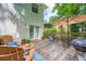 Outdoor living on a wood deck featuring comfortable seating and a dining area with a grill, perfect for entertaining at 3841 Admiral Dr, Atlanta, GA 30341