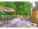 Enjoy a peaceful outdoor setting on this wood deck with a seating area and stairs leading to the yard at 3841 Admiral Dr, Atlanta, GA 30341