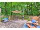 Relax and grill on this spacious deck, complete with Adirondack chairs and a dining set under a shade umbrella at 3841 Admiral Dr, Atlanta, GA 30341