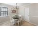 Cozy dining area featuring a round table, modern lighting, and neutral decor at 3841 Admiral Dr, Atlanta, GA 30341