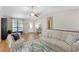 Bright living room featuring a large window, comfortable seating, and hardwood floors at 3841 Admiral Dr, Atlanta, GA 30341