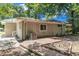 This backyard shows the brick patio and the exterior of the home at 793 Springdale Sw, Atlanta, GA 30315