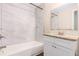 This bathroom features a tub with tile surround, and a granite vanity countertop at 793 Springdale Sw, Atlanta, GA 30315