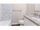 The bathroom features a tub with white tile surround, white toilet, and granite vanity countertop at 793 Springdale Sw, Atlanta, GA 30315