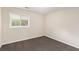 Standard bedroom featuring neutral walls, carpeted floor, and a window at 793 Springdale Sw, Atlanta, GA 30315