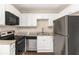 A well-lit kitchen features stainless steel appliances, white cabinets, and granite countertops at 793 Springdale Sw, Atlanta, GA 30315