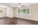 The living room features a ceiling fan, and large windows that brighten the space, and modern wood floors at 793 Springdale Sw, Atlanta, GA 30315