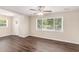 Bright living room with hardwood floors, a ceiling fan, and ample natural light through large windows at 793 Springdale Sw, Atlanta, GA 30315