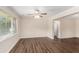 This living room offers a ceiling fan, blinds, hardwood floors, and neutral paint at 793 Springdale Sw, Atlanta, GA 30315