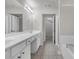 Spacious bathroom with large mirror, dual sinks, and tile flooring. Plenty of room and lighting at 1804 Evadale Ct # 1, Mableton, GA 30126