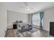 Bedroom featuring a ceiling fan, wood look flooring, window with curtains and a comfortable queen size bed at 1804 Evadale Ct # 1, Mableton, GA 30126