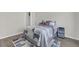 Bedroom with wood look flooring, bed with patterned quilt, and closet at 1804 Evadale Ct # 1, Mableton, GA 30126