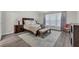 Spacious bedroom features a large window, wood floors, and stylish furnishings at 1804 Evadale Ct # 1, Mableton, GA 30126