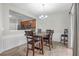 Dining room with barstool seating, pendant lighting, a decorative rug, and tiled floors at 1804 Evadale Ct # 1, Mableton, GA 30126