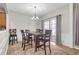 Dining area features pendant lighting, sliding glass doors, and decorative rug at 1804 Evadale Ct # 1, Mableton, GA 30126