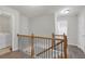 Upstairs hallway featuring wood-look floors, with laundry room and additional bedrooms at 1804 Evadale Ct # 1, Mableton, GA 30126