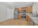 Well-equipped kitchen featuring stainless steel appliances, granite countertops, and wood flooring at 1804 Evadale Ct # 1, Mableton, GA 30126