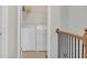 Bright laundry room features side-by-side washer and dryer, convenient shelving for supplies at 1804 Evadale Ct # 1, Mableton, GA 30126