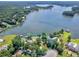 Aerial view of lakefront home with mature trees and private boat dock at 2775 Club Valley Ct, Jonesboro, GA 30236