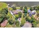 Aerial view of expansive lakefront property with mature landscaping and multiple structures at 2775 Club Valley Ct, Jonesboro, GA 30236