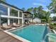 Stunning backyard showcasing the pool, spa, and waterfront views, ideal for luxurious outdoor living at 2775 Club Valley Ct, Jonesboro, GA 30236