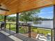 Inviting balcony view with wood ceiling overlooking lake and lush greenery at 2775 Club Valley Ct, Jonesboro, GA 30236